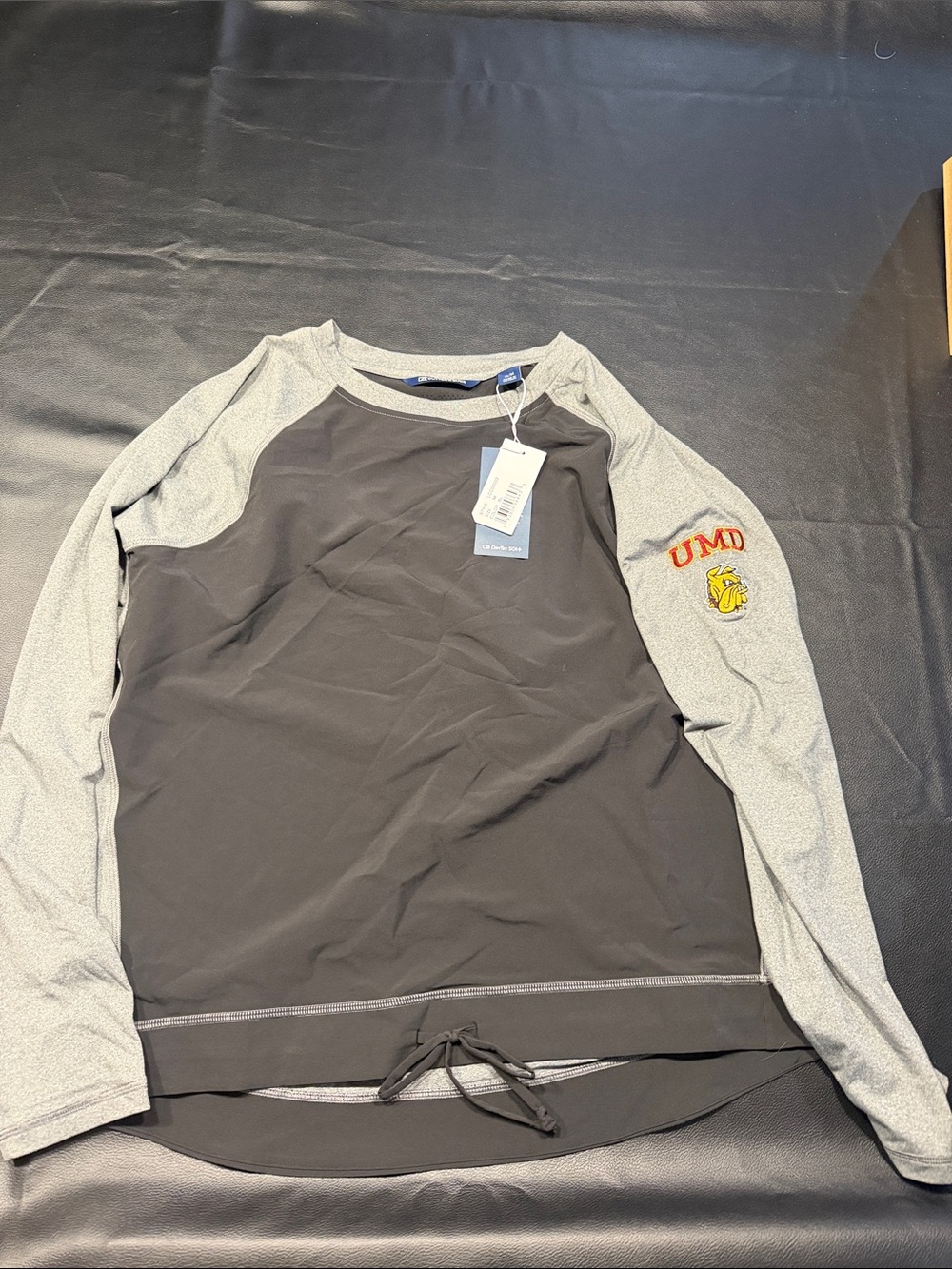 Cutter & Buck Black Body with Gray Raglan Crewneck long-sleeve with UMD logo.